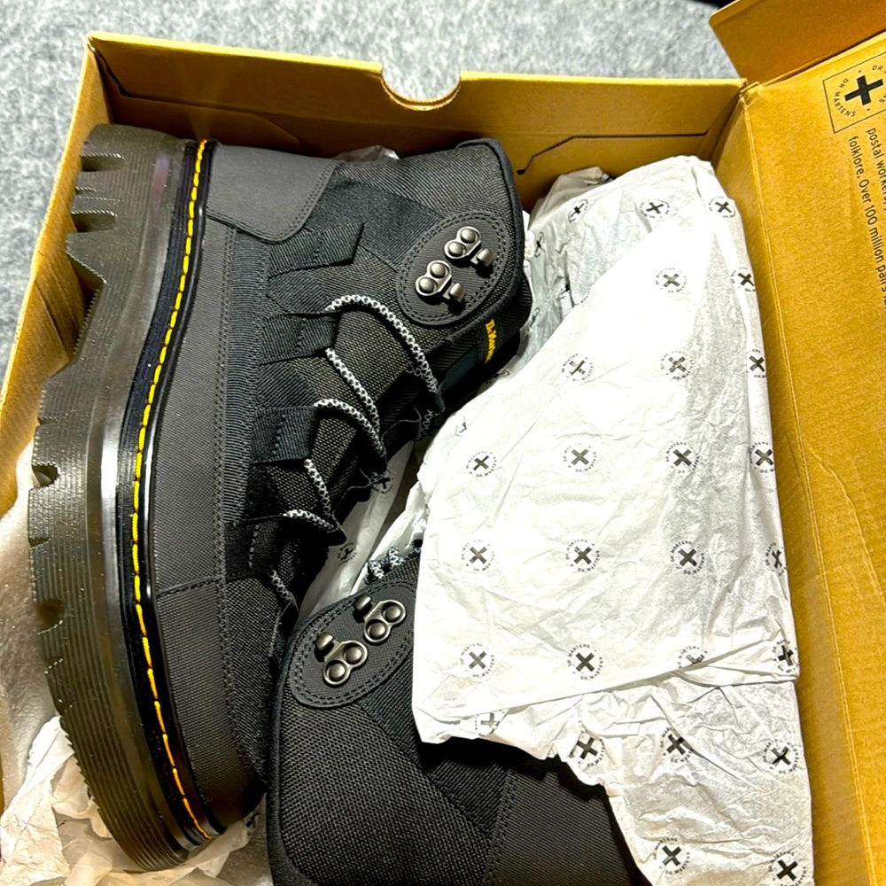 New Dr. Marten men boots in box.
